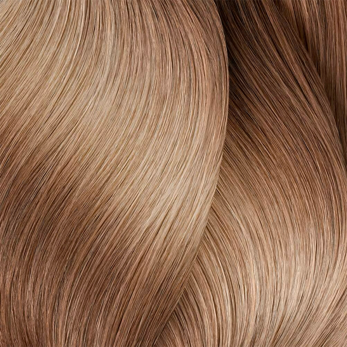 Close-up of wavy hair strands in brown and blonde tones.