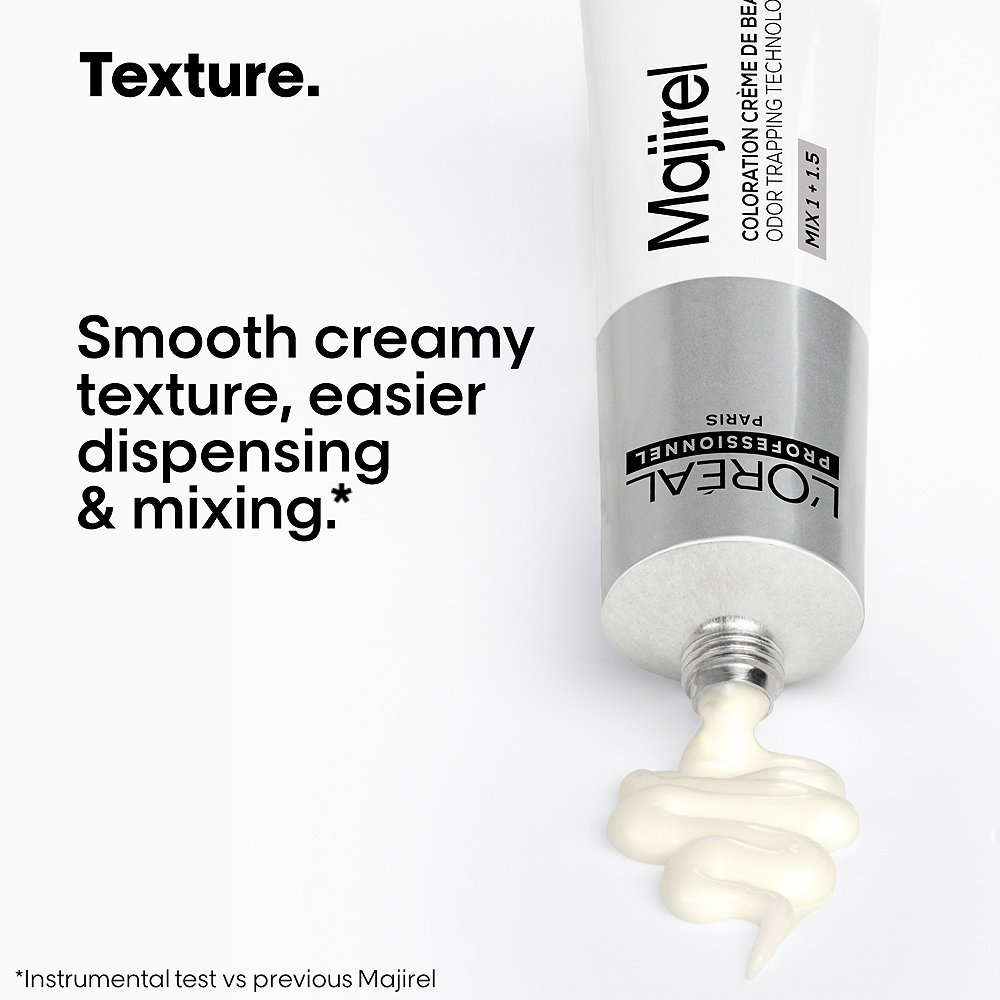L'Oreal Majirel hair color tube with smooth creamy texture on a white background